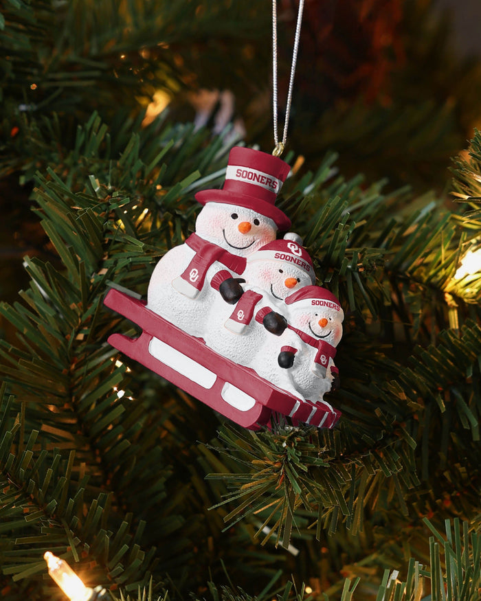 Oklahoma Sooners Sledding Snowmen Ornament FOCO - FOCO.com